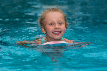 Fototapeta na wymiar happy school girl start to swimming pool