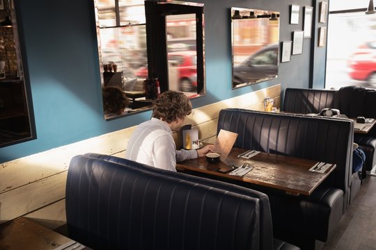Man looking at menu card