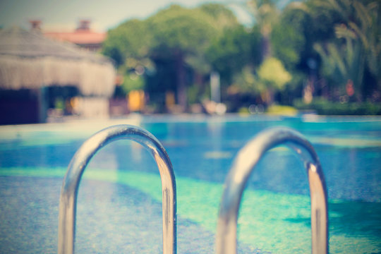 The ladder in pool with a handrail © Артем Постоев