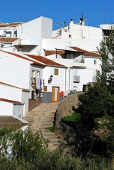 Fototapeta na wymiar Townhouses along a stepped village street, El Burgo, Spain.