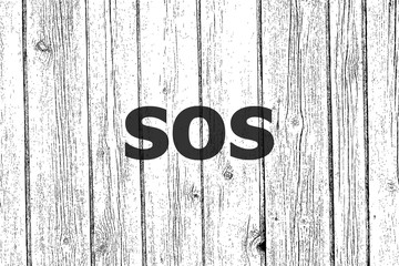 Text Sos. Social concept . Wooden texture background. Black and white