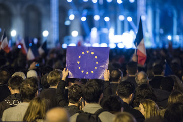 EU flags and France flags shown on a demonstration in Paris. - obrazy, fototapety, plakaty