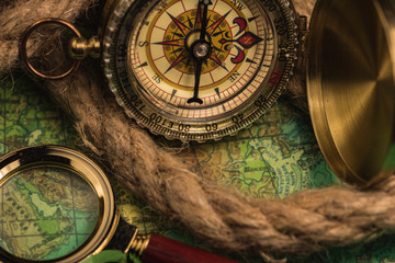 Obraz na płótnie Canvas compass and magnifying glass