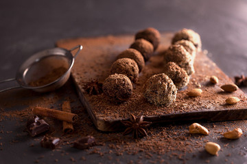 Chocolate candy truffles on a dark background