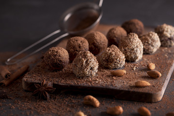 Chocolate candy truffles on a dark background