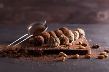 Chocolate candy truffles on a dark background
