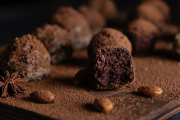 Chocolate candy truffles on a dark background