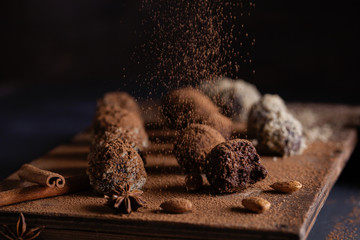 Chocolate candy truffles on a dark background
