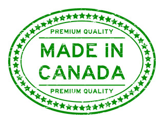 Grunge green premium quality made in Canada oval rubber seal stamp on white background