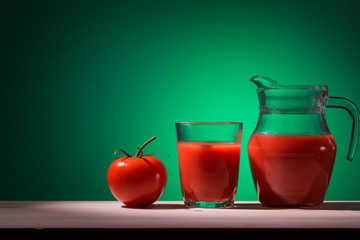 Tomato glass and jug with tomato juice