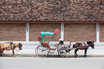 tradition horse carriage is a symbol of Lampang province. - obrazy, fototapety, plakaty