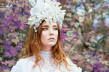 portrait of red hair (ginger) beautiful young girl snow princess in a crown