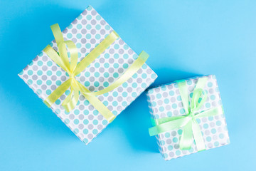 two elegant gift boxes on a blue background