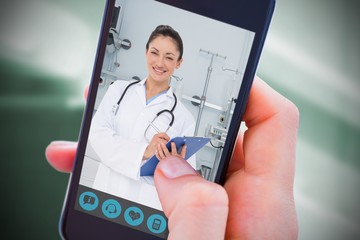 Composite image of woman using her mobile phone