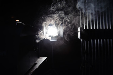 lights in smoke, studio lights shining through the smoke from smoke machine.