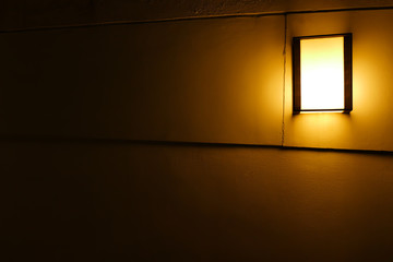 The apanese lamp on the wall.