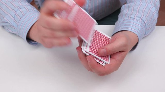 Man divided playing cards