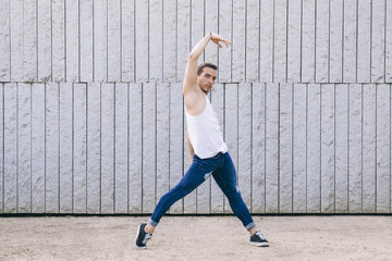 male dancer exercising on a balance casual pose