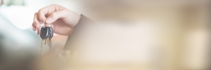 Woman in car receiving keys