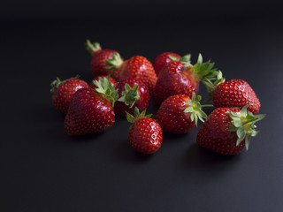 Fresh, red, ripe strawberries isolated on black background