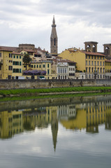 Fototapeta na wymiar Reflections Along the Arno River, Florence, Italy