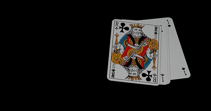 Playing Cards, Four Aces and One King falling againt Black Background, Slow Motion