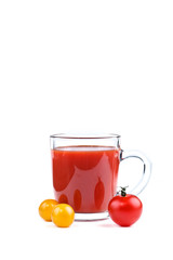 A glass of tomato juice and red and yellow tomatoes on white background.