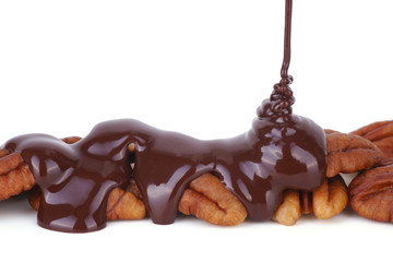 Melted Chocolate Pouring on Pecans