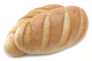 Two baked loaves of golden loaf on top