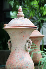 Fototapeta premium Thai Earthenware, ancient jar decorated in garden.