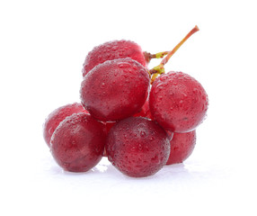 red grapes with water drops isolated on white