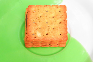 cookies bread square macro focus in the plate on old wooden floor background