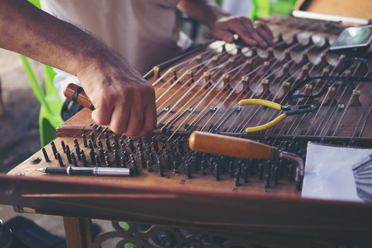 Musicians are setting up musical instruments.dulcimer