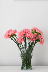 Bouquet of carnation in a glass