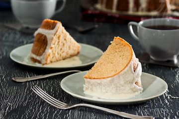 Two Slices of Iced Cinnamon Cake with Hot Tea