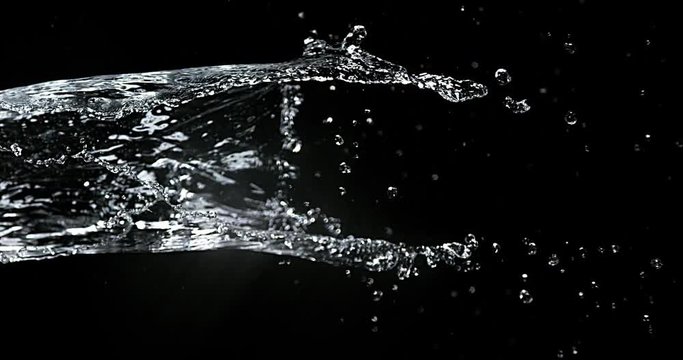 Water spurting out against Black Background, Slow motion 4K