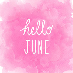 Hello June greeting on abstract pink watercolor background