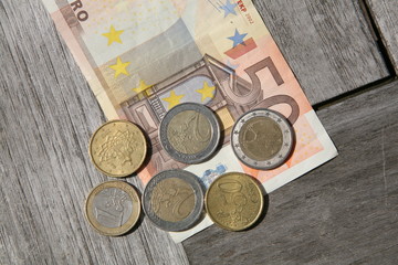euro banknotes and change