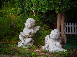 Couple cupid statue In the park..