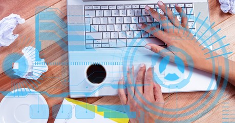 Digital composite image of hands using laptop