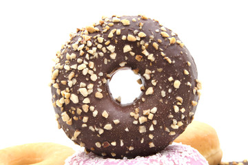 assorted donuts stacked and isolated on white background