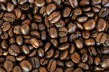 Roasted coffee beans in top view background