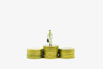 Miniature people manager stand on coins