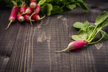 bunch radish on a wooden background/Radish on a dark background