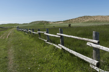 Fototapeta na wymiar Log fence in a field, Prince Edward Island, Canada