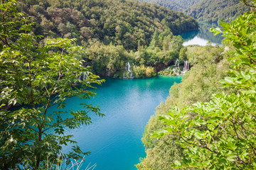 Beautiful summer forest, lake and waterfall