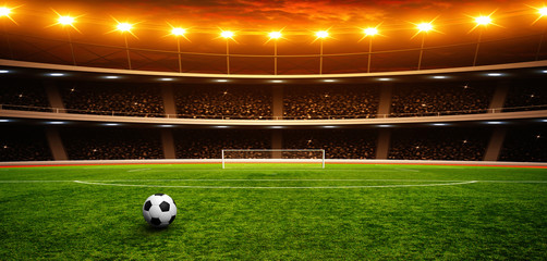 Soccer ball on green stadium
