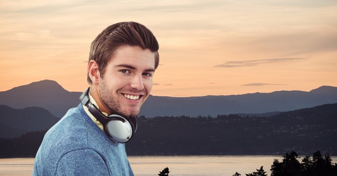 Smiling man wearing headphones - Powered by Adobe