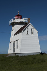 Fototapeta na wymiar Local landmark, a lighthouse, New Glasgow, PEI, Canada