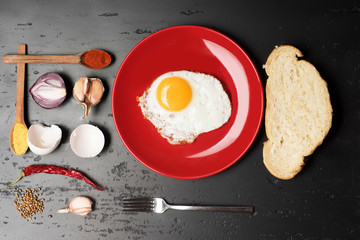 Egg on red ceramic plate